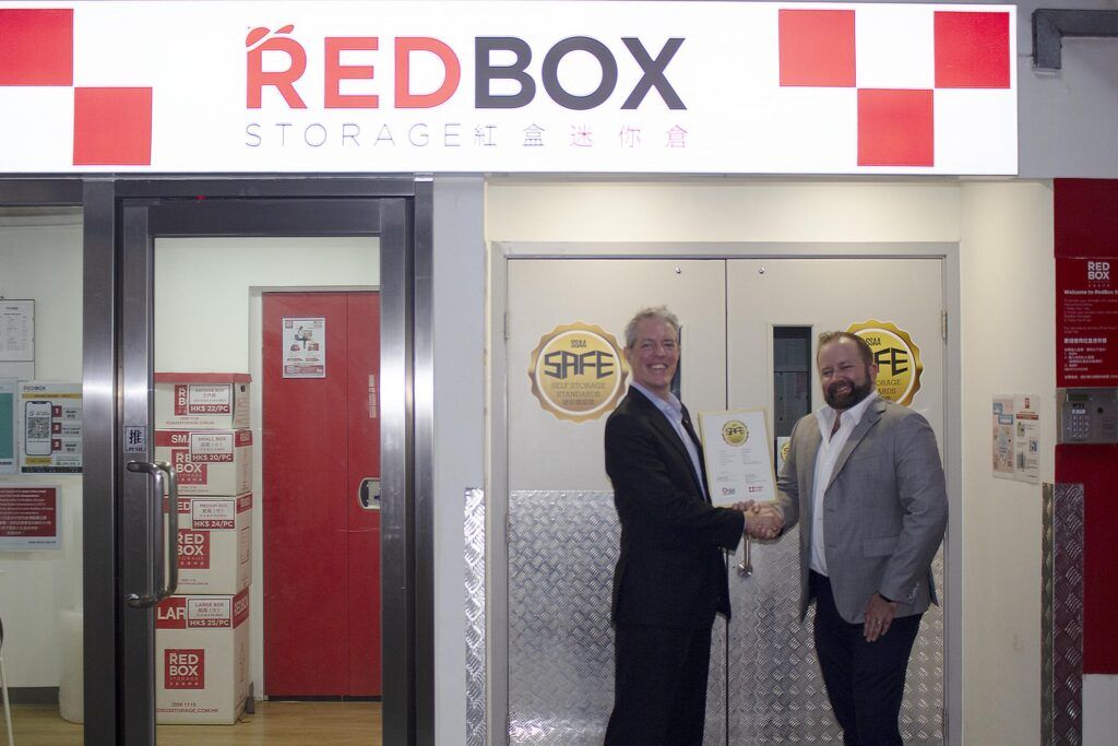 Andrew Work (left, Executive Director, SSAA proudly presents the first SAFE certification to Tim Alpe (CEO, RedBox).