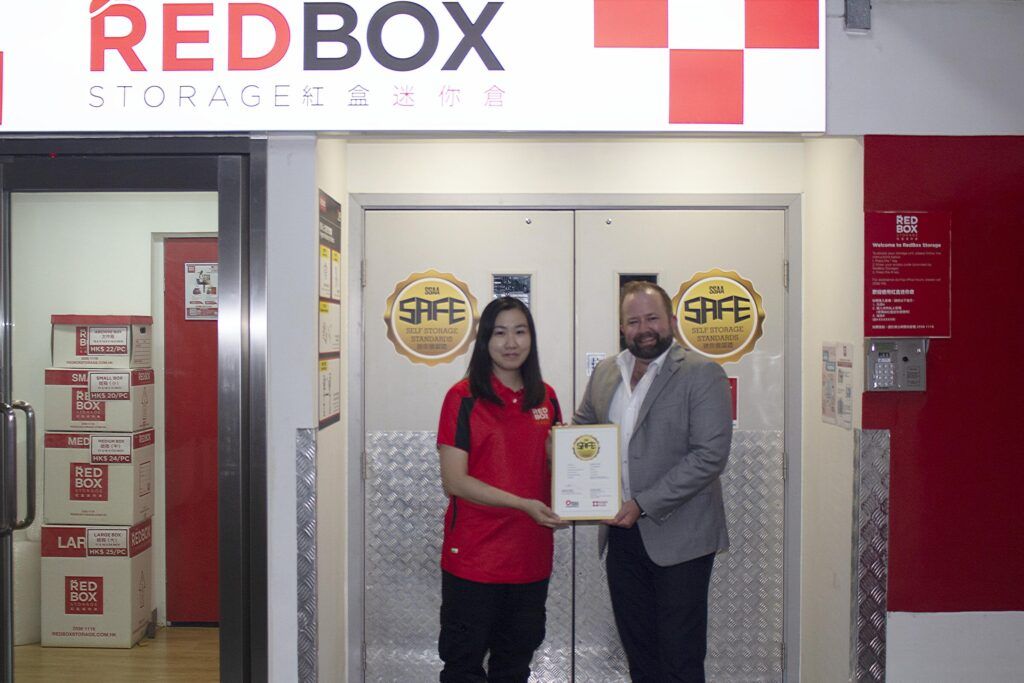 Tim Alpe (right) shares the achievement of the SAFE certification with Vinsy Po (left, Facility Supervisor, RedBox Tuen Mun).